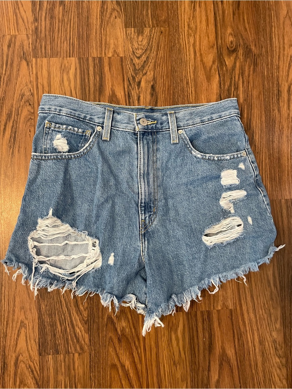 Levi’s Distressed High-Waist Denim Shorts in Light Blue